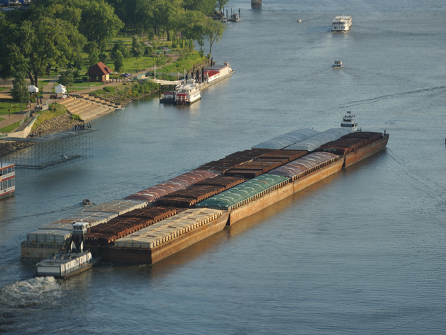 Farm groups and others who work on inland waterways praised President Donald Trump on Wednesday for focusing on dilapidated locks and dams. Pictured here are grain barges moving on the Mississippi River at St. Paul, Minnesota. (DTN/The Progressive Farmer file photo by Jim Patrico)